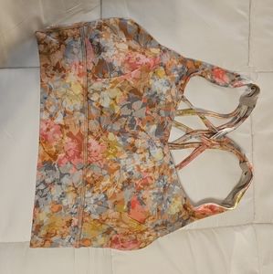 Set of 2 sport bras and 1 pair of leggings. All coordinating. Discontinued print